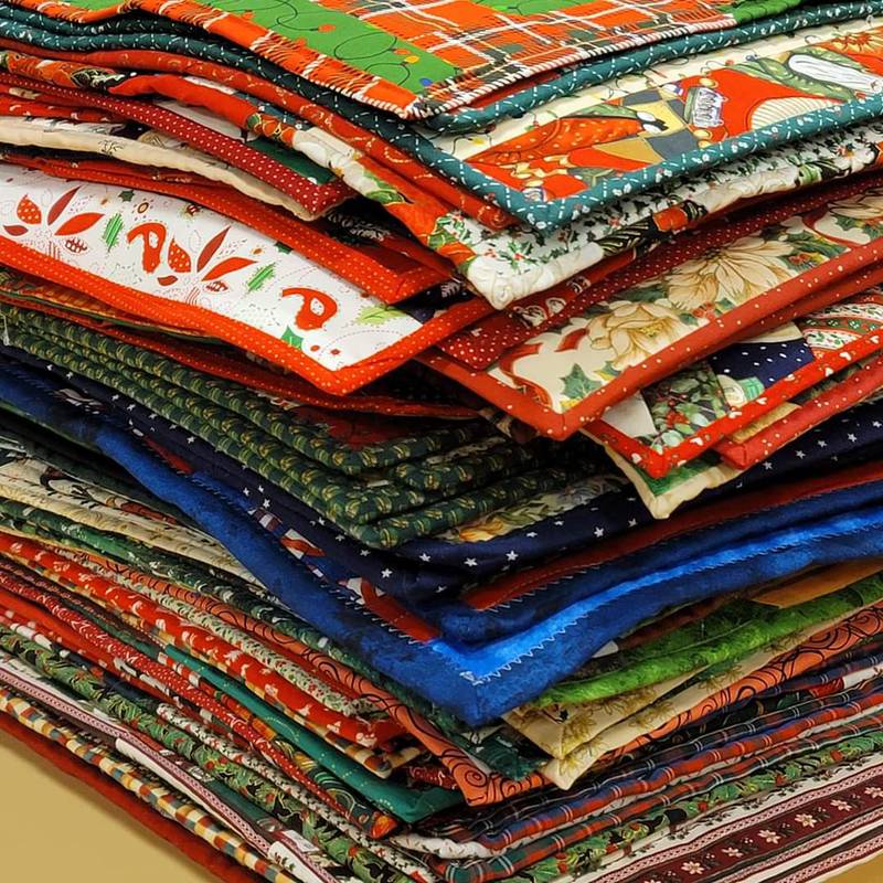Members of the DeKalb County Quilters' Guild donated almost 200 placemats to Voluntary Action Center's Meals on Wheels program. The placemats will be given to Meals on Wheels recipients for their special holiday Christmas Eve lunch.