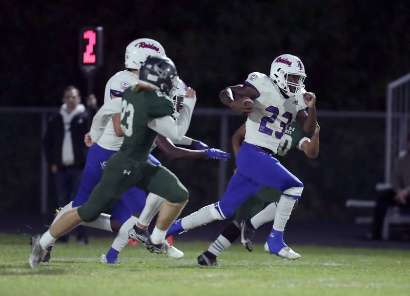 Glenbard South's Jalen Brown (23) heads 90 yards for a touchdown Friday September 23, 2022 in Bartlett.