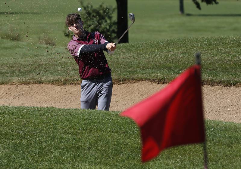 Marengo’s Reliw Weiss watches hits out of the sand trap on the ninth hole during the IHSA 2A Marengo Regional Golf Tournament Wednesday, Sept. 28, 2023, at Marengo Ridge Golf Club.