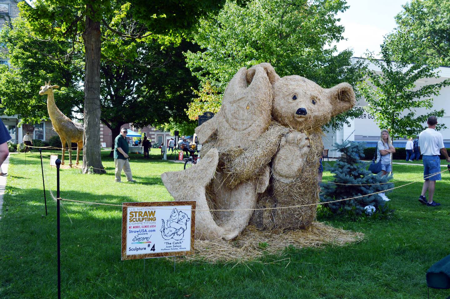 "The Catch," by Juan Zelaya, of Hoffman Estates, was awarded second place for Peoples Choice and Artists Choice in the seventh annual U.S. National Straw Sculpting Competition, which takes place in Mt. Morris.