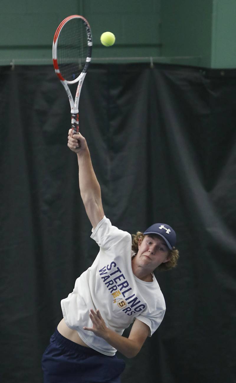 Sterling’s Brecken Peterson serves the ball during his IHSA 1A boys single tennis match against Lake’s Gavin Murrie Thursday, May 26, 2022, at Heritage Tennis Club in Arlington Heights.
