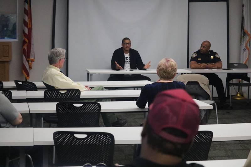 About a dozen were on hand as DeKalb Ward 7 Alderman John Walker (left) and DeKalb Police Chief David Byrd speak Wednesday, June 7, 2023 at a Ward 7 meeting held at the DeKalb Police Department.