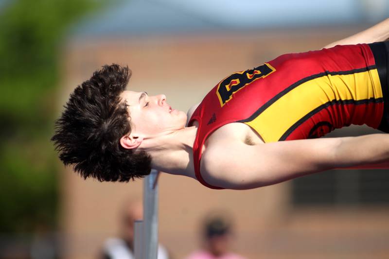 Batavia’s Alec Crum clears the bar in the high jump competition during the Class 3A St. Charles North Sectional on Thursday, May 19, 2022.