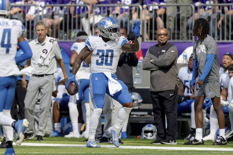 Detroit Lions running back Jamaal Williams (30) reacts after a play during the first half of an NFL football game against the Minnesota Vikings, Sunday, Sept. 25, 2022 in Minneapolis. (AP Photo/Stacy Bengs)