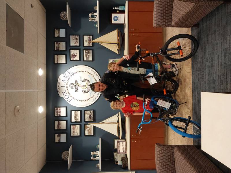 Trey and Connor Stewart of Wonder Lake met with Officer Cawley, who is the school resource officer and a bike patrol officer, on June 18 to show off their new bikes.