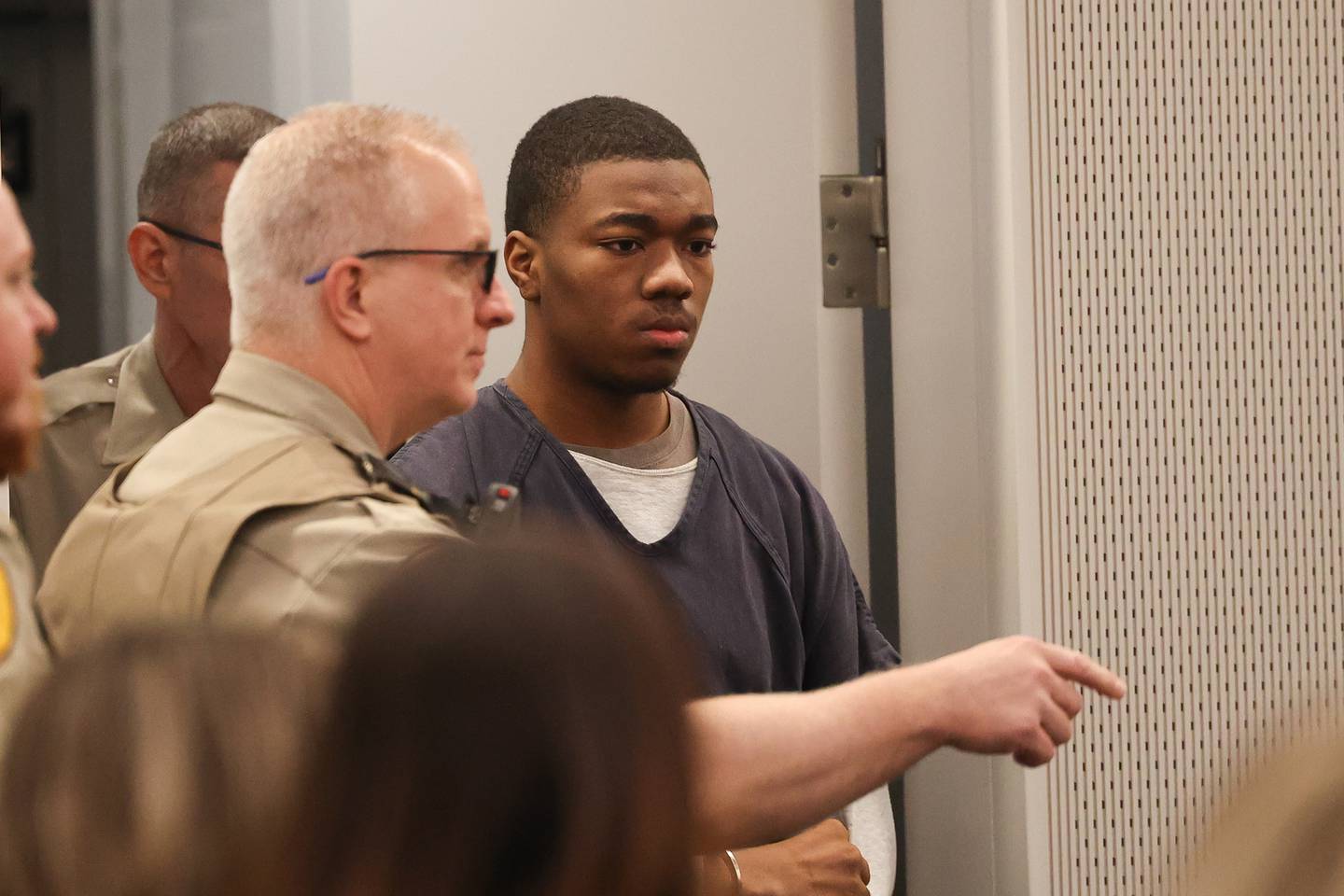 Byrion Montgomery, 17, of Bolingbrook, is directed into the courtroom for a hearing at the Will County Courthouse on Thursday, March 30, 2023 in Joliet. Montgomery is accused of the murders of Cartez Daniels, 40, Samiya Shelton-Tillman, 17, and Sanai Daniels, 9, at a residence in the 100 block of Lee Lane in Bolingbrook, as well as attempted first-degree murder of Tania Stewart.