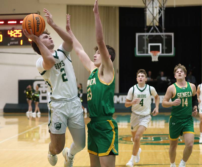 St. Bede's Gus Burr eyes the hoop as Seneca's Chris Gedraitis guards him on Tuesday, Dec. 16, 2025 at St. Bede Academy.