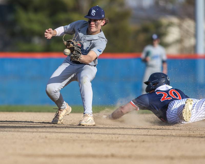 Plainfield South's Cameron Kelliher (1) fields the throw while Oswego's Dylan King (20) into second during baseball game between Plainfield South at Oswego on Monday, April 14, 2025 in Oswego.