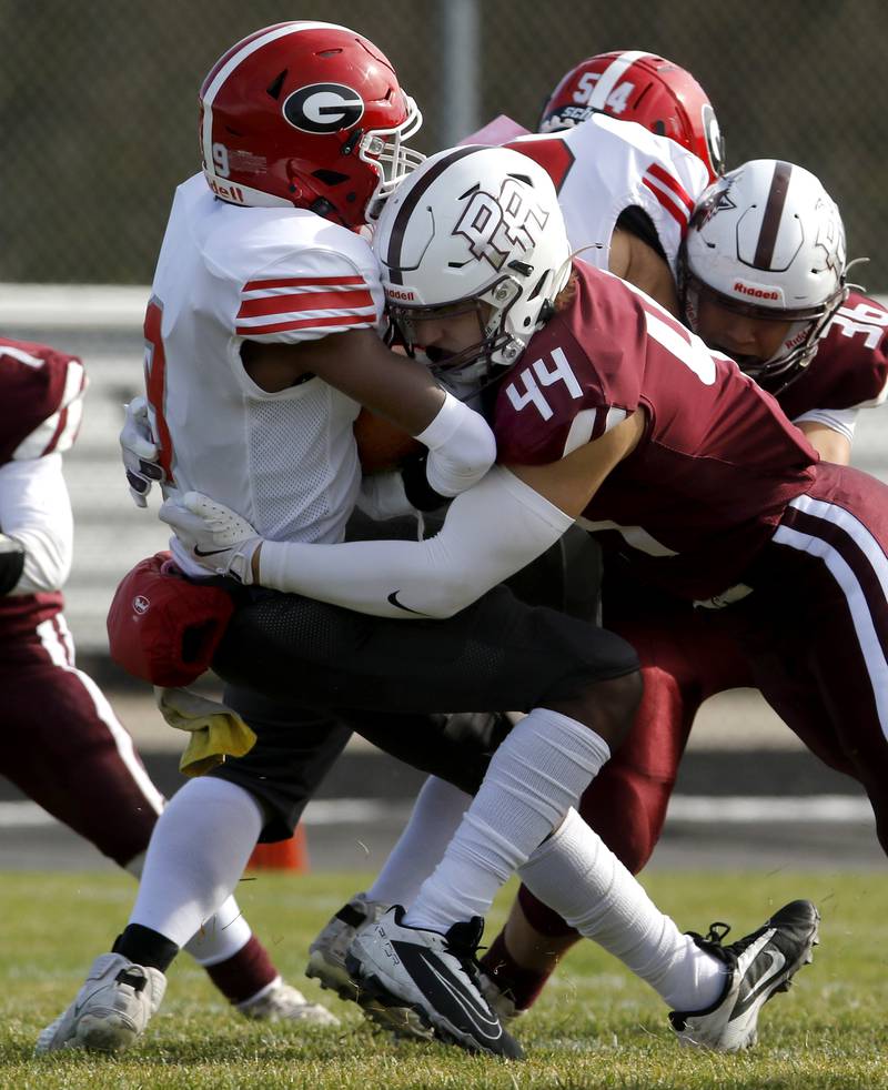 Prairie Ridge's Jace Kranig tackles Chicago Goode's Quaylen Dobbs in the backfield during an IHSA Class 5A first-round football game on Saturday, Nov. 2, 2024, at Prairie Ridge High School in Crystal Lake.