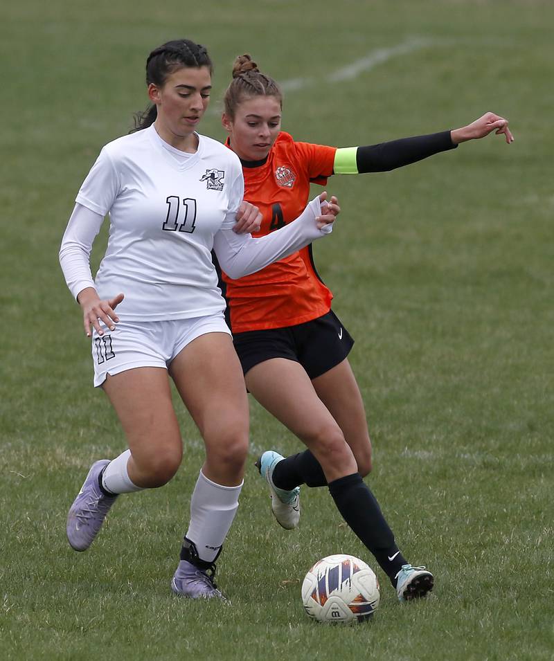 Kaneland's Corinne Faivre battles with Crystal Lake Central's Hadley Ferrero for control of the ball during a nonconference soccer game on Thursday, April 10, 2025, at Crystal Lake Central High School.