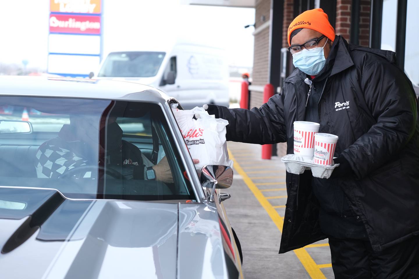 Michael Portillo, Vice President of Restaurant Support, receives his order at the open of the new Joliet Portillo’s location on North Larkin. Tuesday, Feb. 1, 2022 in Joliet.