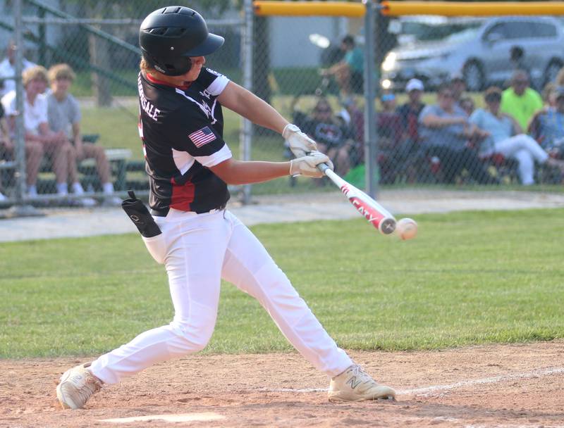 Spring Valley's Drew Carlson makes contact with the ball against Michigan the Central Region Baseball Tournament on Monday, July 24, 2023 at Washington Park in Peru.