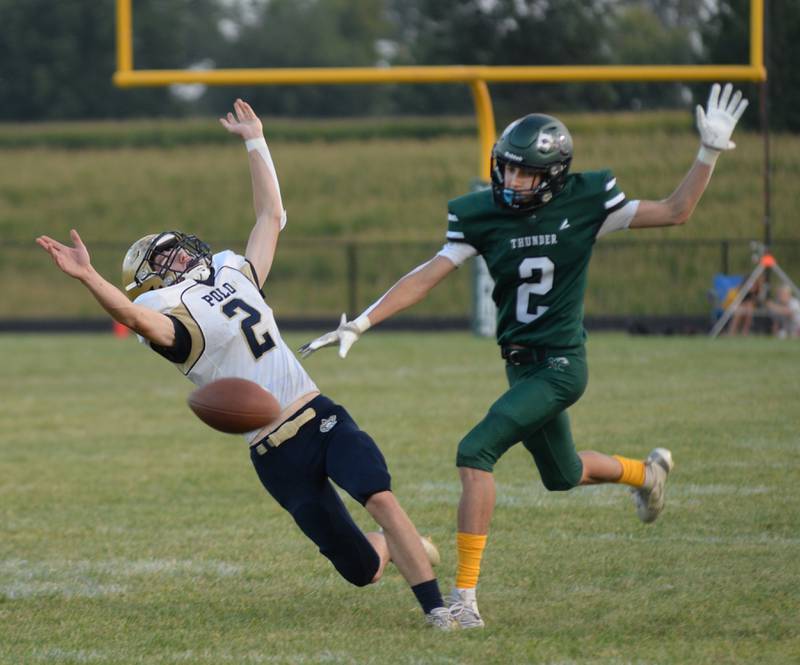 Polo's JT Stephenson (2) and West Carroll's Ryker Budimlija (2) go after the ball in 8-man football action in Mt. Carroll on Friday, Sept. 12, 2025.