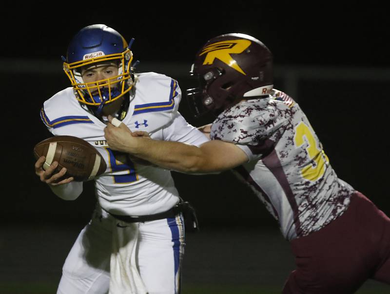 Johnsburg's Anthony Bravieri is tackled by Richmond-Burton's Steven Siegel during a Kishwaukee River Conference football game Friday, Oct. 7, 2022, between Richmond-Burton and Johnsburg at Richmond-Burton Community High School in Richmond.