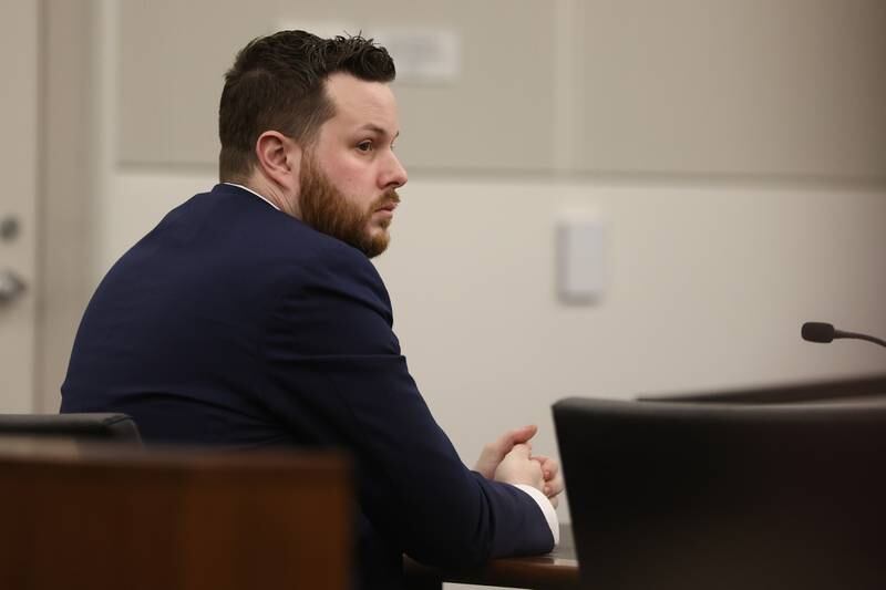 Defendant Sean Woulfe listens to closing arguments on Monday at the Will County Courthouse. Sean Woulfe, 29, is charge with reckless homicide of Lindsey Schmidt, 29, and her three sons, Owen, 6, Weston, 4, and Kaleb, 1. Monday, Mar. 28, 2022, in Joliet.