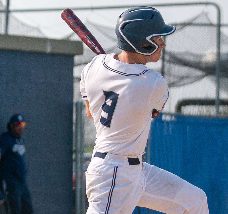 Oswego East's Zachary Polubinski (9) homers against Oswego during a baseball game at Oswego East High School on Tuesday, May 10, 2022.