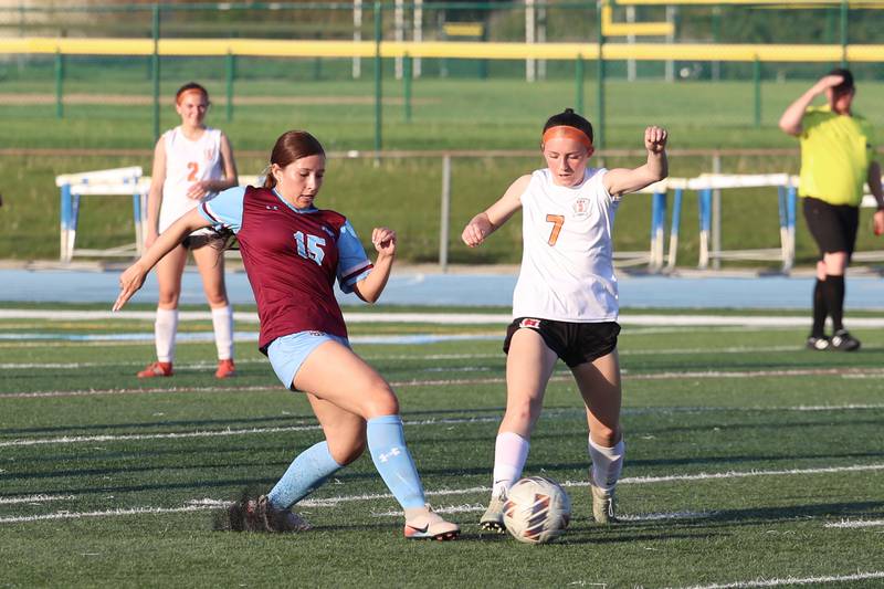 Kankakee's Vanessa Arellano lunges to defend Beecher's Braelynn Scanlan during Kankakee's 8-4 victory over Beecher on Wednesday, April 22, 2026.