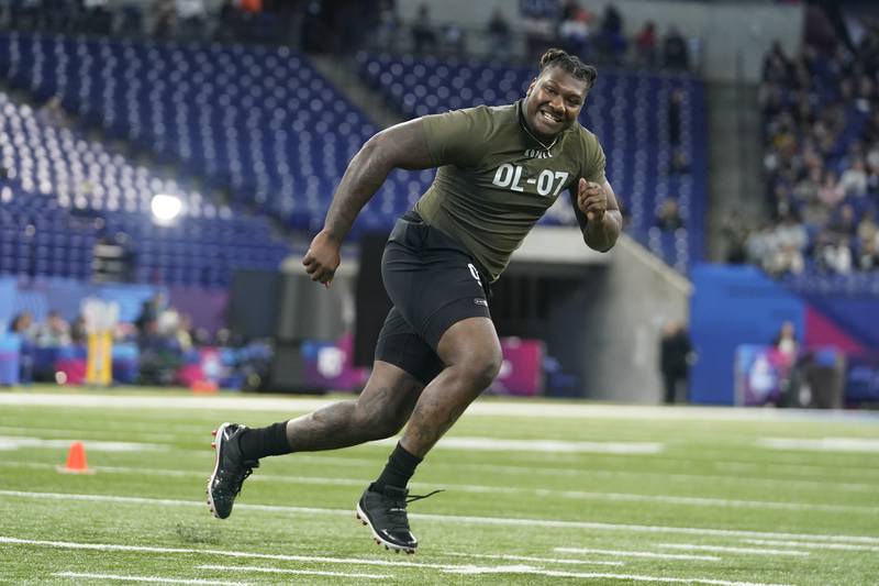 Florida defensive lineman Gervon Dexter runs a drill at the NFL Combine in Indianapolis, March 2, 2023. The Chicago Bears addressed their shaky defense in the second round of the NFL draft, taking Dexter with the No. 53 pick and Miami cornerback Tyrique Stevenson three spots later after trading up with the Jacksonville Jaguars.