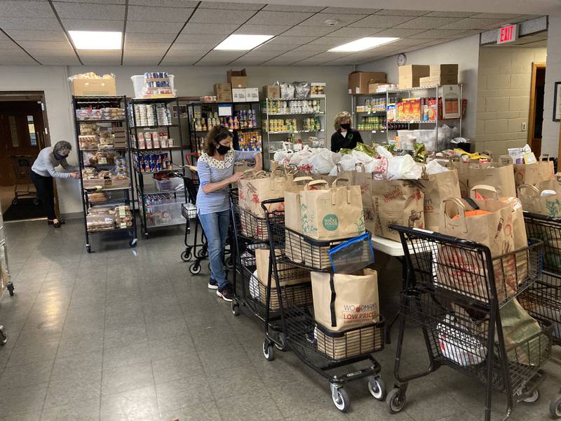 Volunteers at the Glen Ellyn Food Pantry prepare sort groceries for distribution. Food pantries throughout DuPage County are responding to an increased demand as a result of inflation and the after effects of the pandemic. (Photo provided)