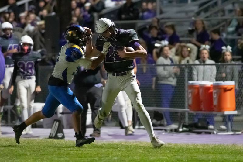 Wilmington's Brysen Meents protects the ball during the Wildcats' 49-7 victory over Tri-Valley in the quarterfinal game on Saturday, Nov. 15, 2025.