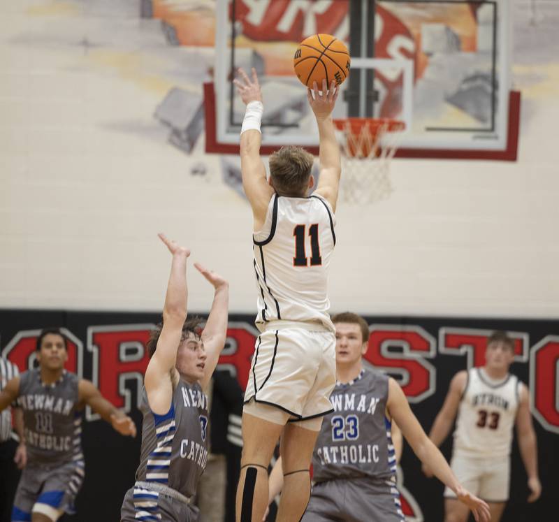 Byron’s Cason Newton puts up a shot at the buzzer for the win against Newman Friday, Dec. 19, 2025, in the Forreston Holiday Tournament title game. The shot fell short.