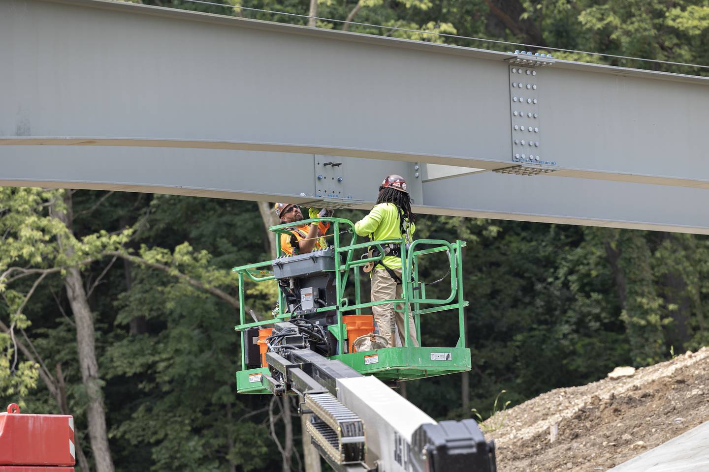 Workers join girders on the bridge Thursday, August 7, 2025, at Project Rock in Dixon.