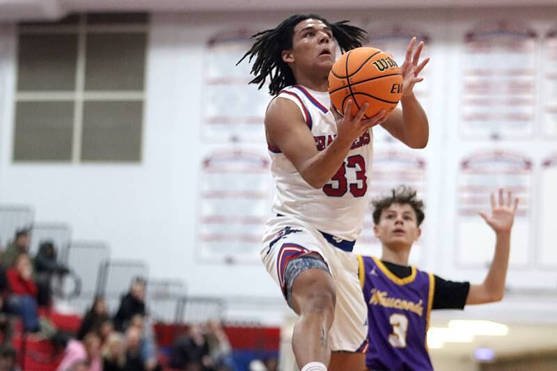 Dundee-Crown’s Anthony Spain glides to the hoop against Wauconda in varsity basketball Friday, Dec. 20, 2024 at Dundee-Crown High School in Carpentersville.