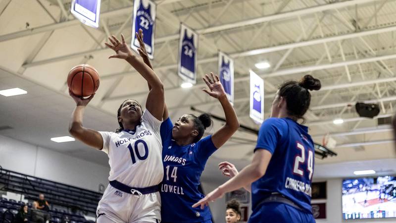 Holy Cross senior forward Janelle Allen, a Marian Central graduate, goes up for the shot against University of Massachusetts Lowell on Nov. 13, 2023 in Worcester, Massachusetts.
