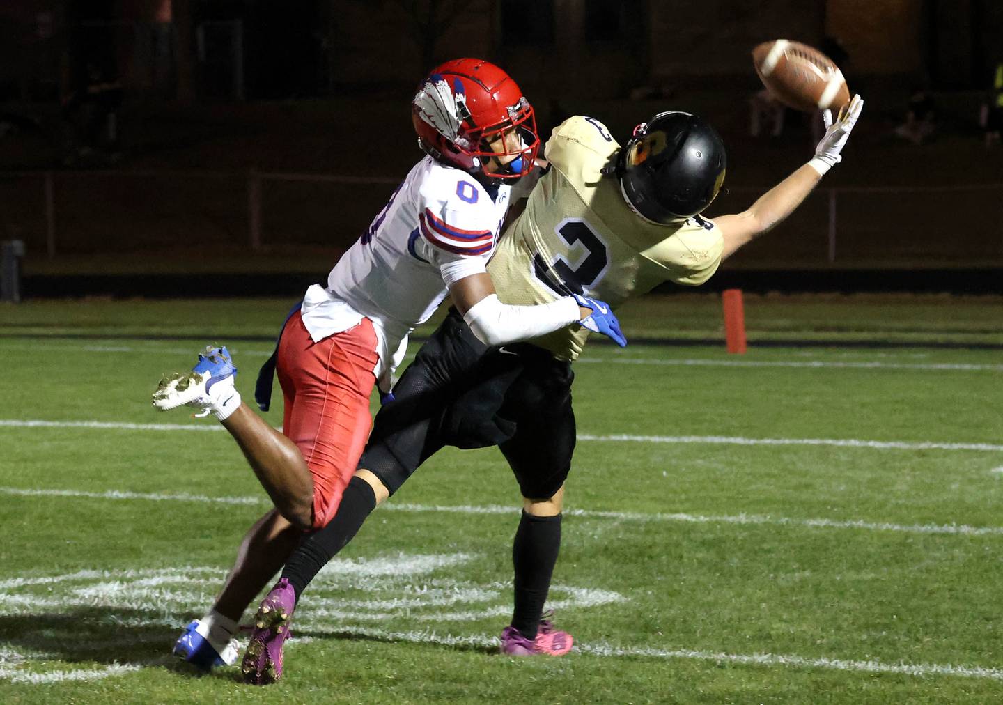 Sycamore's Carter York tries to make a catch as Cahokia's Antonio Morris provides the coverage Friday, Oct. 25, 2024, at Sycamore High School.