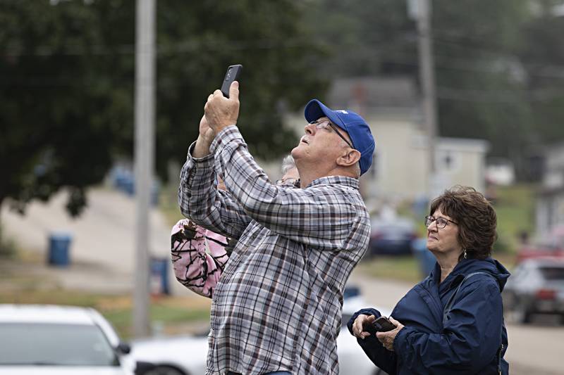 Richard Summers, 66, of Dixon snaps some pictures of the steeple removal Wednesday, Sept. 13, 2023. Summers has been a parishioner of the church all his life.