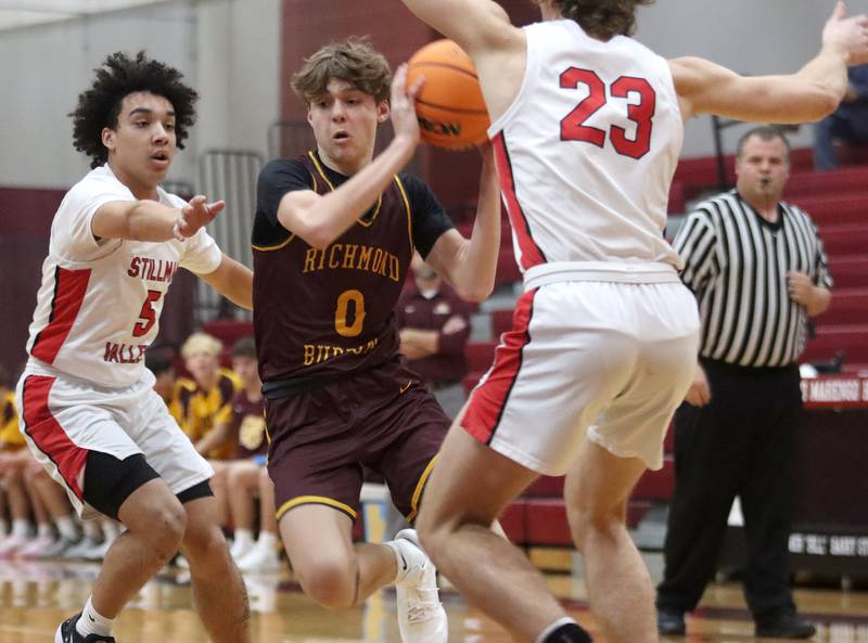 Richmond-Burton’s Gavin Radmer navigates heavy traffic against Stillman Valley during 74th Annual E.C. Nichols Holiday Classic varsity boys basketball tournament action on Saturday, Dec. 28, 2024 at Marengo High School in Marengo.