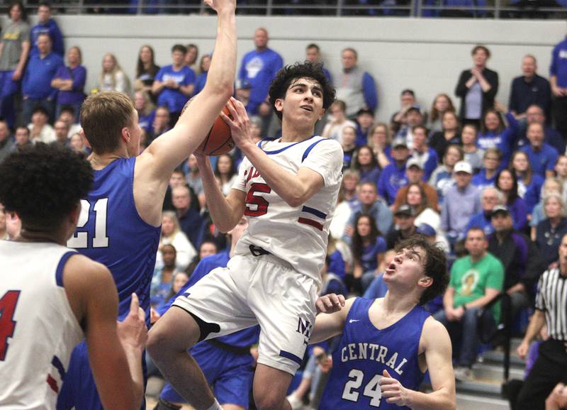 Marmion Academy’s Jacob Piceno glides under the hoop in IHSA Class 3A Sectional title game action at Burlington Central High School Friday night.