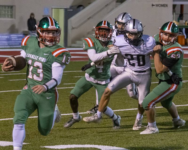 LaSalle Peru Defense holds back Kaneland's Dominick DeBlasio allowing Brady Romagnoli to gain extra yards during the game on October 20, 2023.