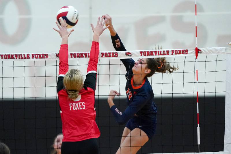 Oswego’s Sidney Hamaker (13) goes up for a kill attempt against Yorkville's Lilianna Casbarian (9) during the Class 4A Yorkville Regional final at Yorkville High School on Thursday, Oct. 31, 2024.