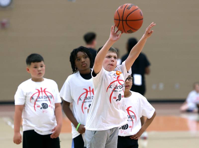 Atendees go through a drill Saturday, May 24, 2025, during the A'Jah Davis Foundation Basketball Camp and Wellness Day at DeKalb High School.