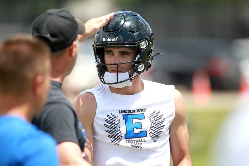 Lincoln-Way East’s Blaise LaVista talks to a coach during a 7 on 7 tournament on Thursday, June 26, 2025 at Naperville North.