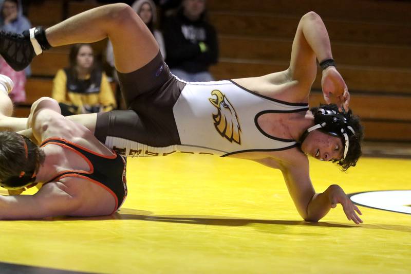 Jacobs’ Hugo Prado tries to escape from Crystal Lake Central’s Tommy Tomasello at 165 pounds in varsity wrestling on Thursday, Jan. 16, 2025, at Jacobs High School in Algonquin.