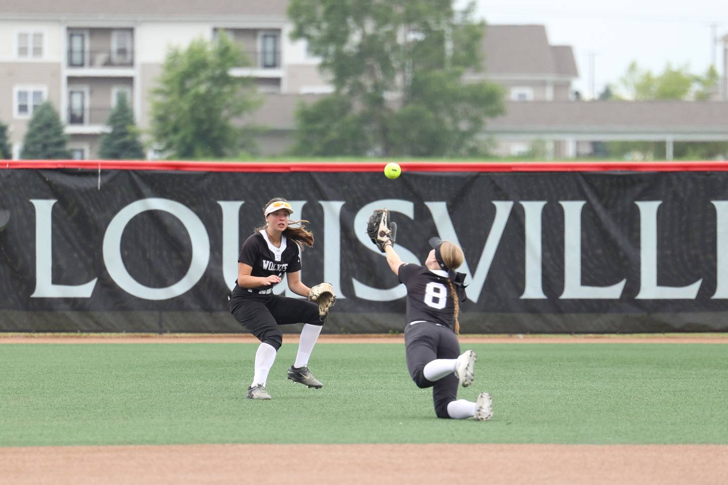 Prairie Ridge's Adysen Kiddy (8) attempts a diving catch as teammate Autmn Ledgerwood arrives for backup during the Wolves' 5-0 loss to Glenwood in the IHSA Class 3A state semifinal on June 13, 2025.