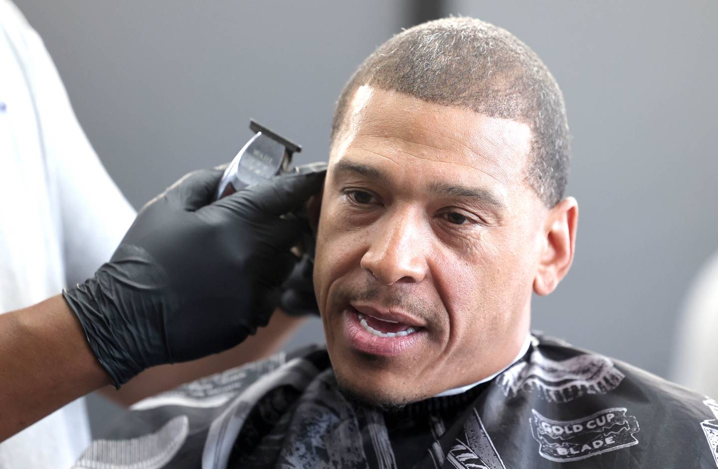 Newly elected DeKalb Ward 7 Alderman John Walker gets a hair cut from Lyndon Gay and talks about his first month as an alderman Thursday, June 1, 2023, at Roc's Barber Shop in DeKalb.