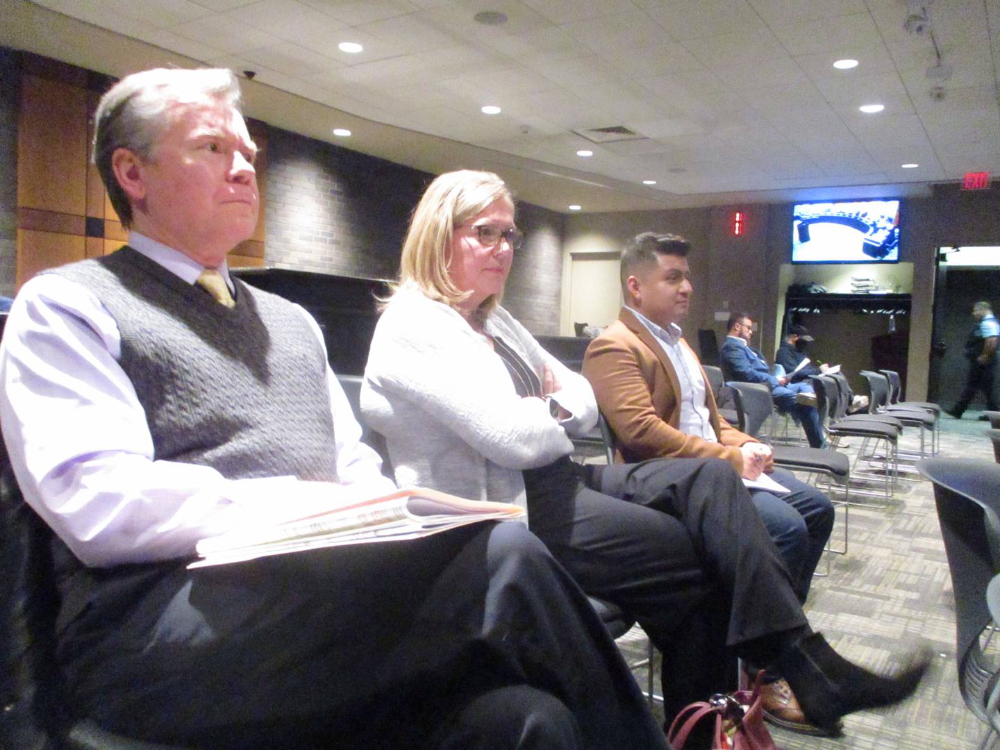 Volunteers of America Illinois President and CEO Nancy Hughes Moyer (center) awaits questions about the organization's Joliet project at a City Council meeting on Monday, Dec. 4, 2023.