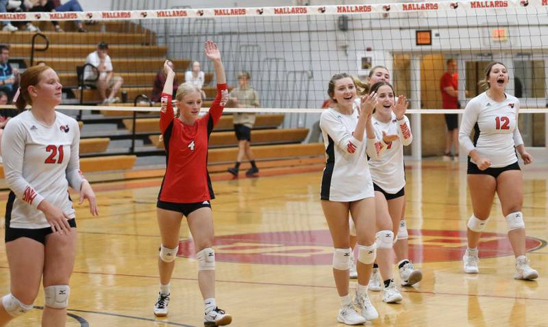 Members of the Henry-Senachwine volleyball team react after defeating Woodland on Thursday, Oct. 3, 2024 at Henry-Senachwine High School.