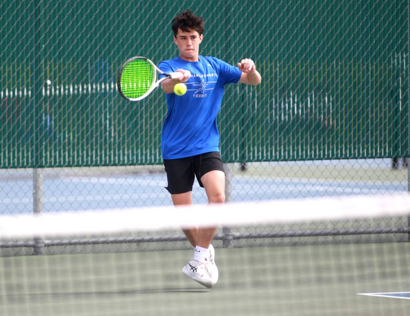 St. Charles North’s Ben Goddard returns the ball during the first round of the 2A boys state tennis meet with doubles partner Cole Weddle (not pictured) on Thursday, May 29. 2025 at Hersey High School.