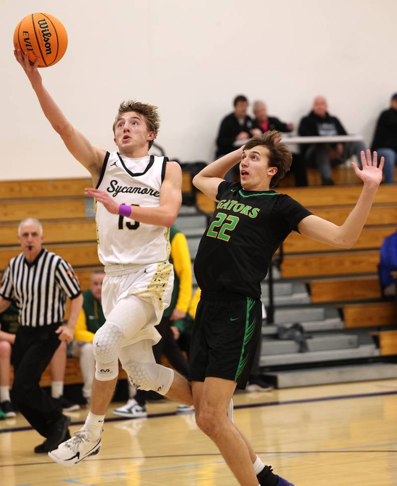 Sycamore's Xander Lewis gets to the basket ahead of Crystal Lake South's Tony Santarelli during their sectional semifinal game Tuesday, March 4, 2025, at Rochelle High School.