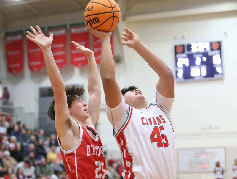 L-P's Andy Medina eyes the hoop as Ottawa's Lucas Farabaugh defends