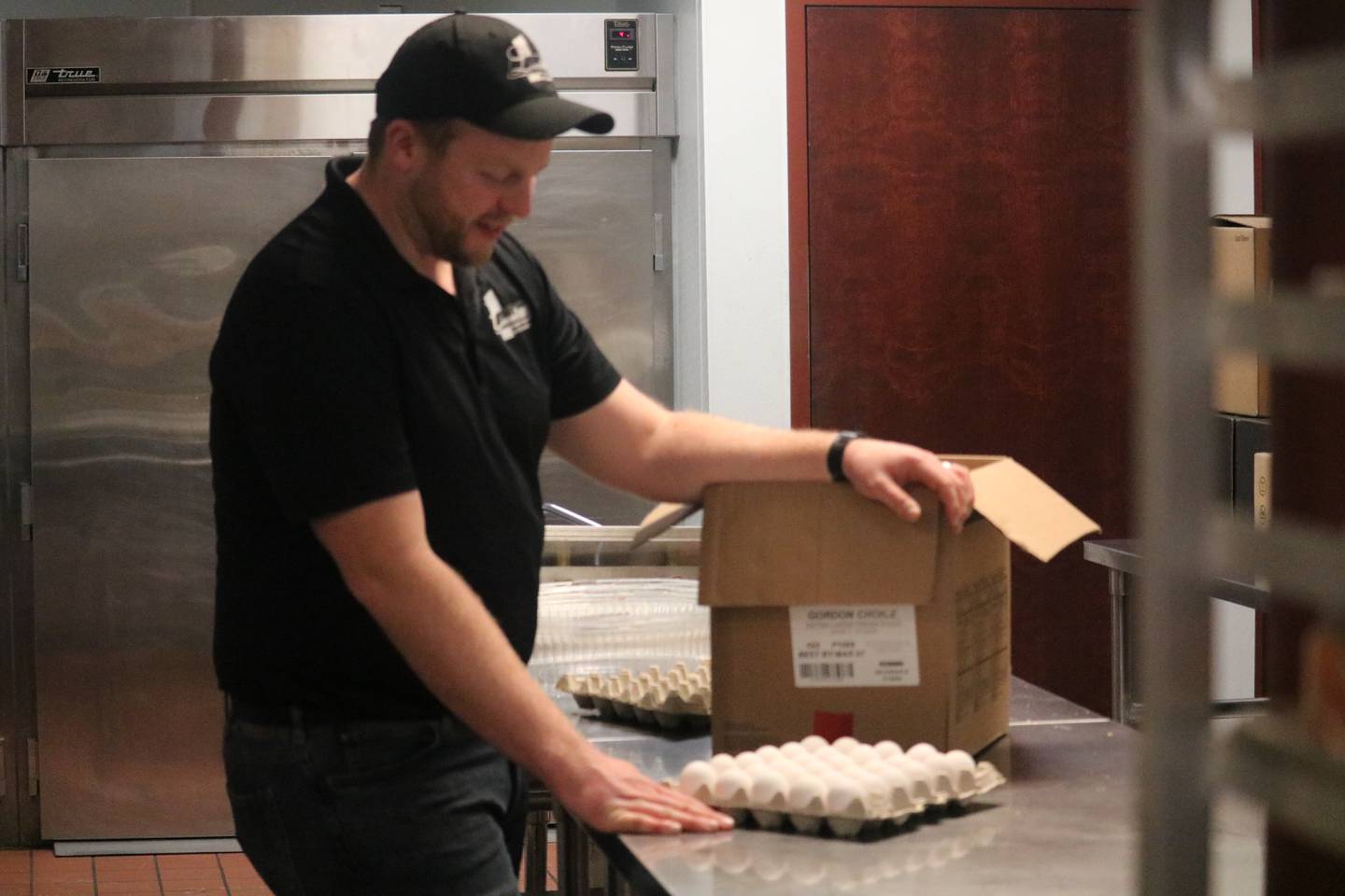Faranda's General Manager Anthony McMahon takes a carton of eggs out of the container Thursday, February 13, 2025 in the kitchen at the Lincoln Inn at Faranda's in DeKalb.