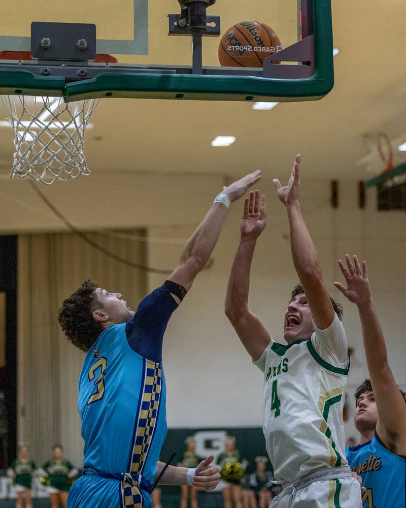 Gino Ferrari (4) of St. Bede shoots layup as Easton DeBernardi (3) of Marquette attempts to contest shot on Friday, January 16, 2026 at St. Bede Academy in Peru.