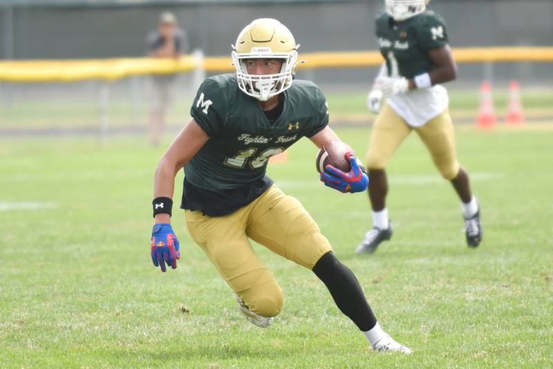 Bishop McNamara's Coen Demack turns upfield after making a reception during a home game against Lawrenceville Saturday, Aug. 30, 2025.