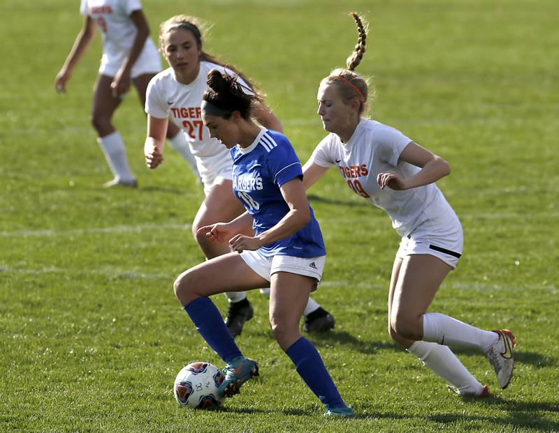 Dundee-Crown's Berkley Mensik controls the ball in front of Crystal Lake Central's Sadie Quinn, left, and Maddie Gray, right, during a Fox Valley Conference soccer match Tuesday April 26, 2022, between Crystal Lake Central and Dundee-Crown at Dundee-Crown High School.