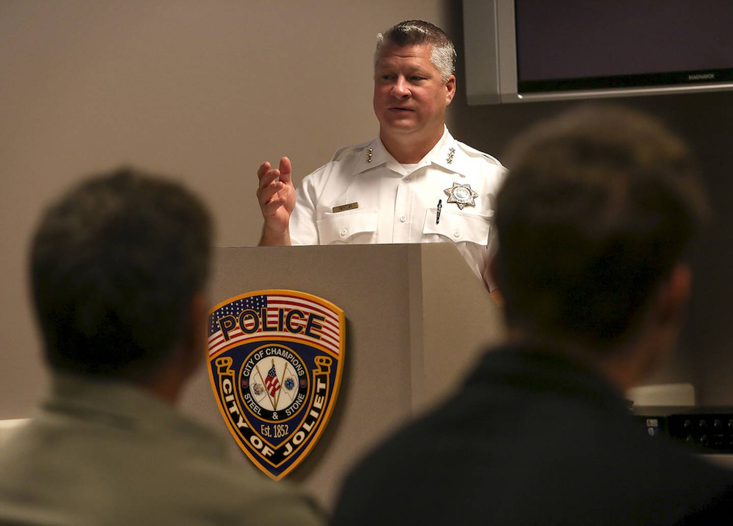 Joliet Police Chief Brian Benton introduces patrol officer Myles Klein before being sworn-in to his position Tuesday at the Joliet Police Department in Joliet.