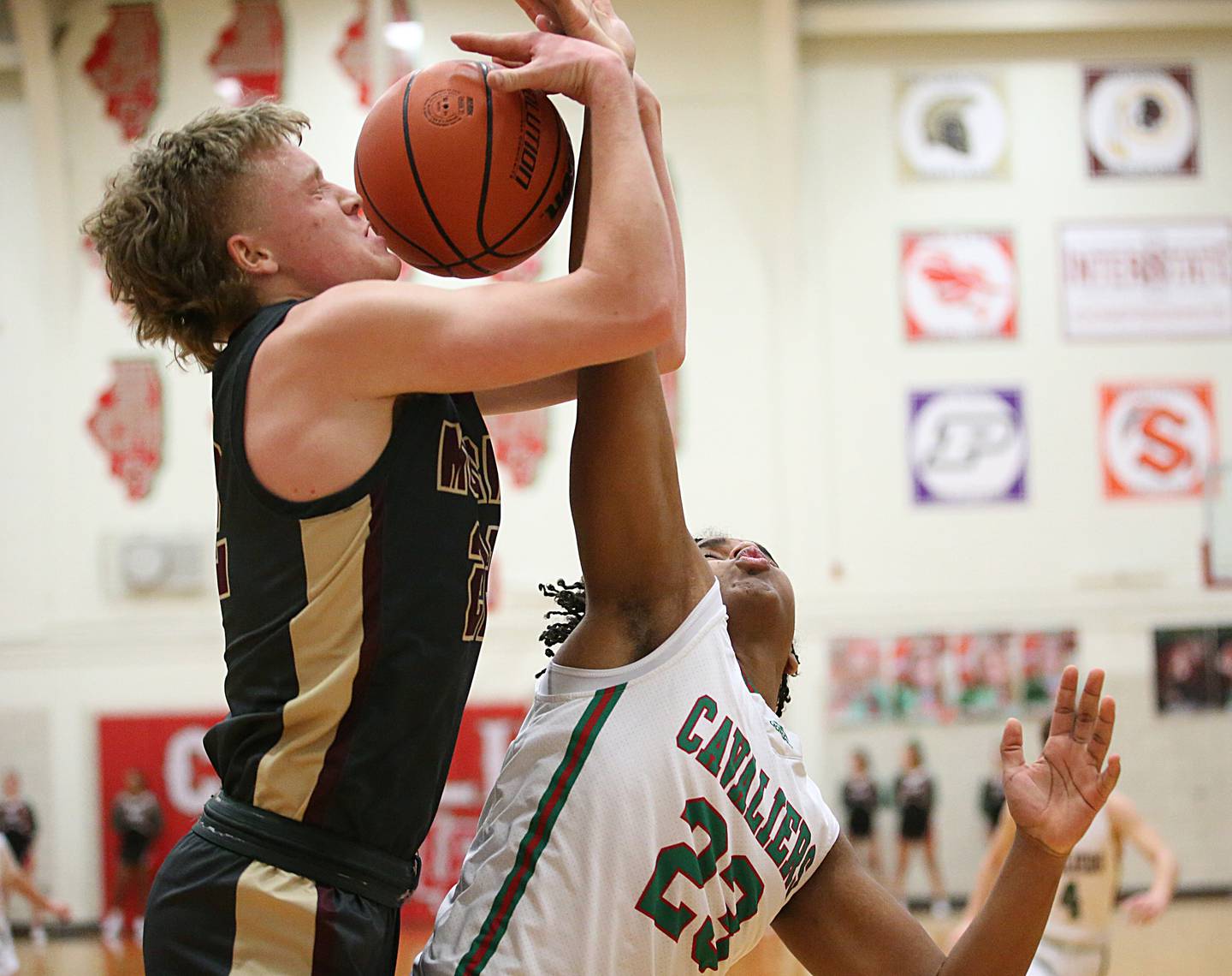 Morris' Gage Phillips and L-P's Maalik Madgrigal fight to pull down a rebound in Sellett Gymnasium on Friday, Jan. 13, 2023, at L-P High School.